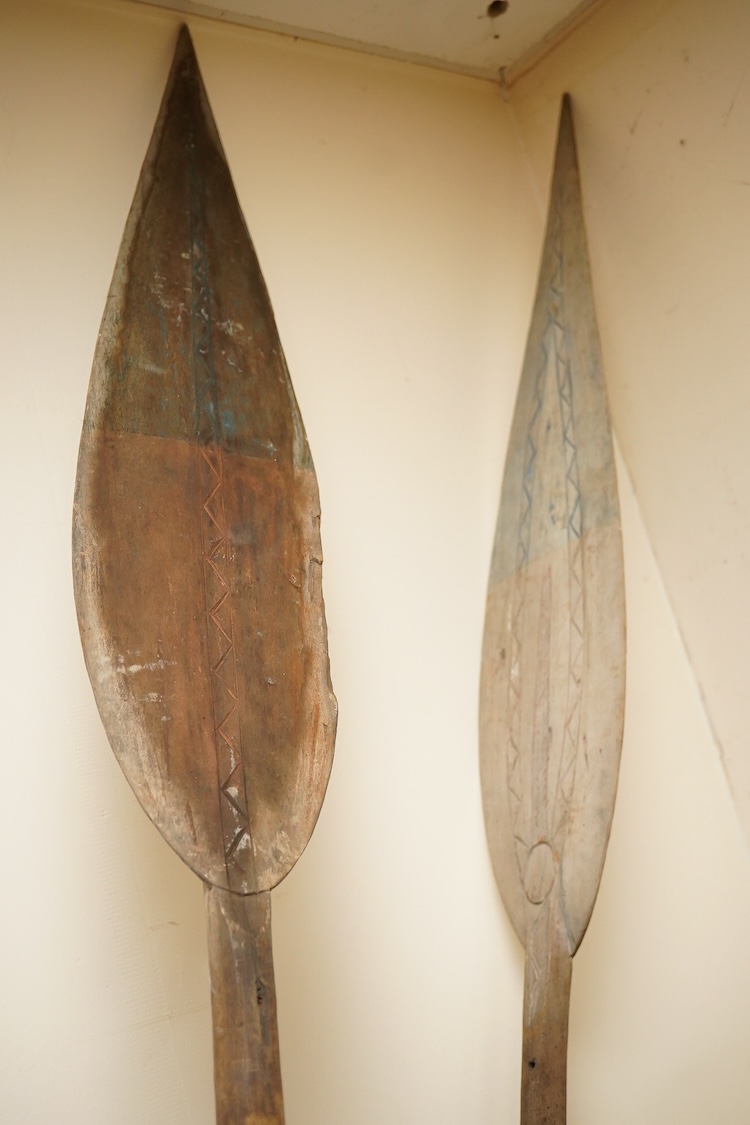 A pair of tribal paddles, 180 cm long